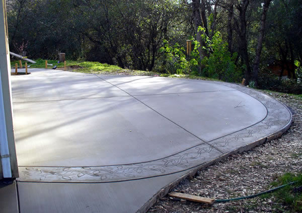 A concrete patio pad with beautiful stylish curves.